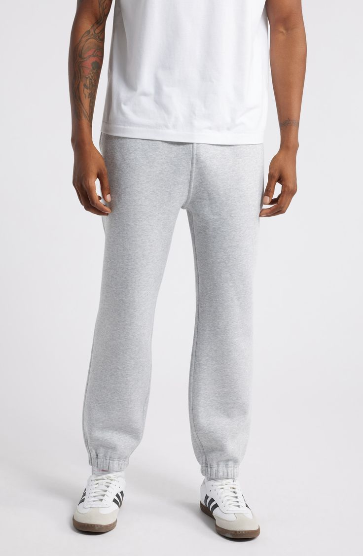 Made from soft cotton-blend fleece, these classic joggers are your go-to pair for lounging, the gym or the street. 27" inseam; 10" leg opening; 12 1/2" front rise; 15" back rise (size Medium) Elastic/drawstring waist Side-seam pockets; back patch pocket 70% cotton, 30% polyester Machine wash, tumble dry Imported Not available for sale and shipment to Germany Gray Activewear With Ribbed Cuffs For Loungewear, Gray Activewear For Loungewear, Fleece Sweats For Loungewear In Athleisure Style, Comfy Fleece Joggers For Loungewear, Comfortable Fleece Joggers, Cozy Fit Fleece Joggers, Fleece Sweatpants With Comfort Waistband For Loungewear, Comfy Cozy Fit Fleece Joggers, Cozy Fit Sweatpants With Ribbed Cuffs For Loungewear