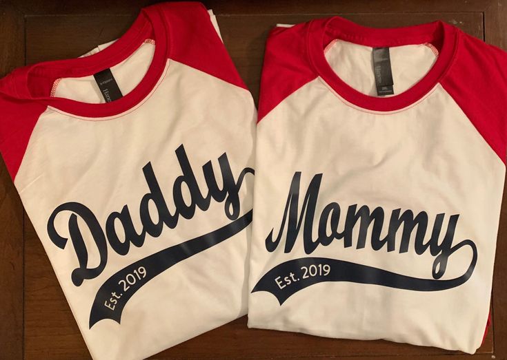 Baseball Theme Mommy or Daddy with Est date. Goes great with "ROOKIE of the Year child's shirt (see options in site listings). Custom Print Tops For Father's Day Fan Merchandise, Father's Day Fan Merchandise Tops With Custom Print, Cotton Graphic Print Shirt For Family Events, Custom Print Red T-shirt For Father's Day, Red Custom Print T-shirt For Father's Day, Family Matching Fan Merchandise Tops With Custom Print, White Shirt With Letter Print For Family Events, Family Matching Red Tops With Custom Print, White Top With Name Print For Family Events