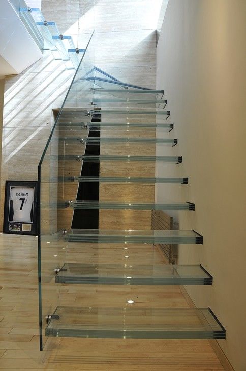 glass stairs leading up to the second floor