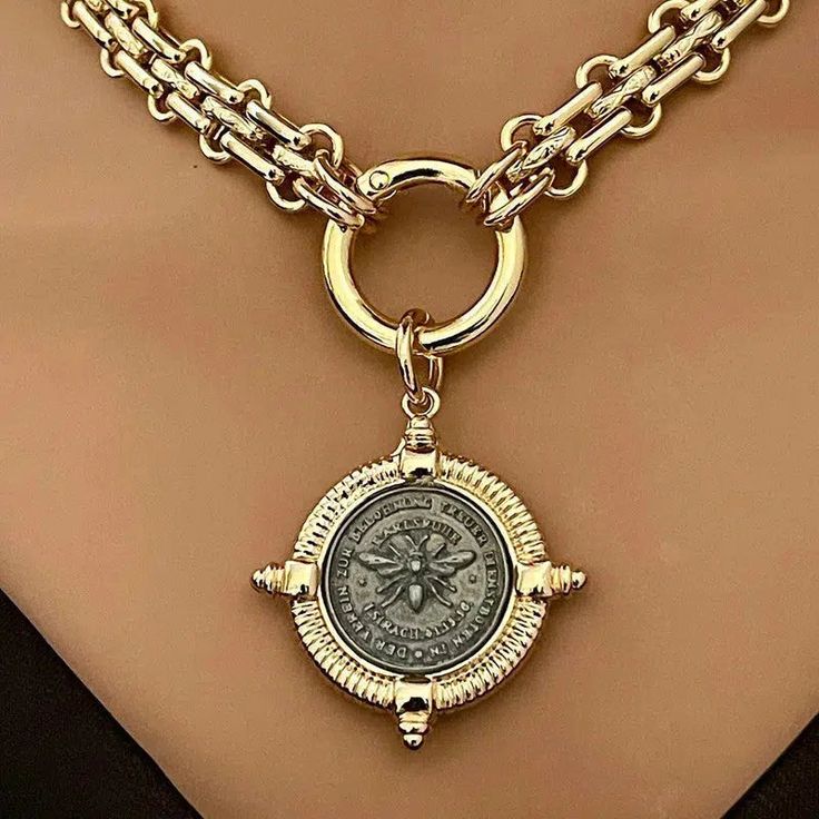 Stunning chunky, gold textured chain with a replica French Bee pendant in a 4 spiked bezel. The spring ring clasp is easy to open and close. A truly beautiful Art Deco-inspired piece. Choice of 3 pendants #1 All gold #2. Gunmetal coin/Gold Bezel #3 Gold coin/GunmetalBezel Choose your preference from the drop-down menu to order. Mixed metal colors and materials have become a big fashion statement. The shiny gold chain necklace is gold electroplated brass and is 11mm wide, chunky and thick. Great Beautiful Gold Necklaces, 18k Gold Necklace, Golden Necklace, Bee Pendant, Beading Ideas, Cameo Necklace, Gold Coin, Coin Jewelry, Necklace Online