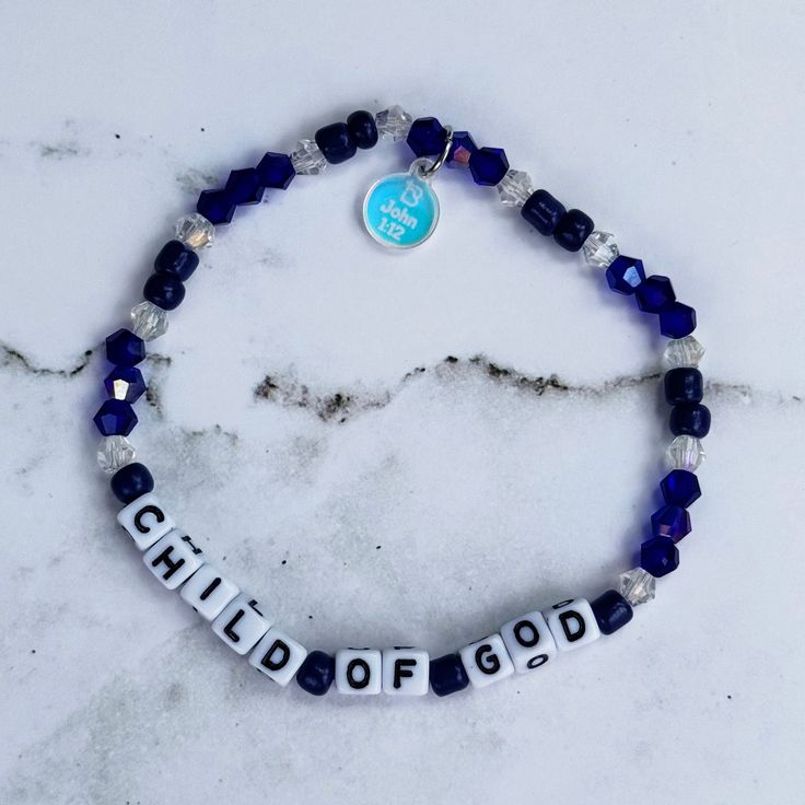 Step into a daily embrace of faith with the "Child of God Bracelet" from our cherished God Says Collection. Inspired by the profound message of John 1:12, this bracelet beautifully symbolizes the power and grace bestowed upon us as children of God. “But to all who did receive him, who believed in his name, he gave the right to become children of God,” (John 1:12, ESV) Imagine starting your day with a gentle reminder of your divine identity, as the bracelet’s intricate blend of crystal and seed beads glimmers with every movement. Each piece is meticulously handcrafted in Texas, ensuring not just a unique design but a heartfelt touch with every creation. The "Child of God Bracelet" is more than just an accessory; it’s a statement of faith. The included acrylic tag, etched with a scripture re Christian Beaded Jewelry, Christian Bracelet Ideas, Christian Beaded Bracelets, God Bracelet, John 1 12, Faith Bracelet, Christian Bracelets, Primary Activities, Child Of God