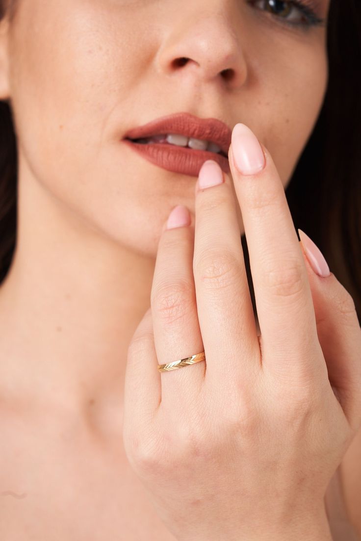 This elegant gold ring features a sophisticated multi-band design with a delicate small central gemstone. The intricate bands wrap gracefully around your finger, providing a modern and stylish look. Perfect for everyday wear or special occasions, this ring adds a touch of elegance and charm to any outfit. A beautiful gift for someone special or a lovely addition to your own jewelry collection. Features: * Material: 14K Yellow & White Gold * Handmade item * Comfortable Fit for Everyday Wear * Shi Elegant Adjustable Birthstone Toe Ring, Elegant Promise Toe Ring, Timeless 14k Gold Rings With Decorative Band, Elegant Midi Rings For Anniversary, Elegant Stackable Rings For Gifts, Elegant Adjustable Stackable Rings For Promise, Timeless Yellow Gold Bands As Gift, 14k Gold Jewelry With Ring Detail For Wedding, Dainty Adjustable Diamond Ring For Formal Occasions