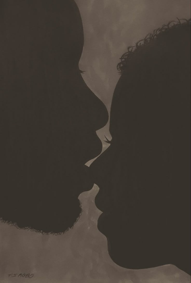 the silhouette of two people kissing each other