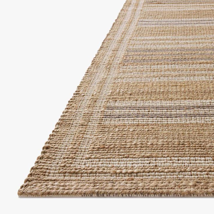 a beige rug with stripes on it