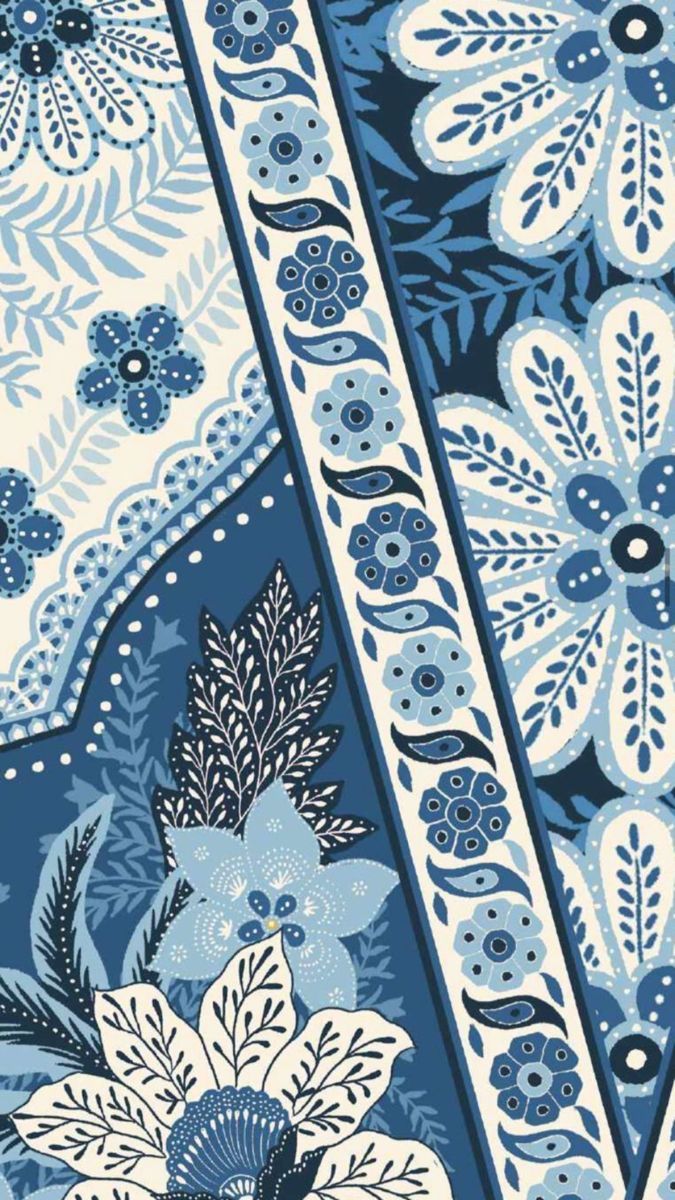 a blue and white floral design on fabric