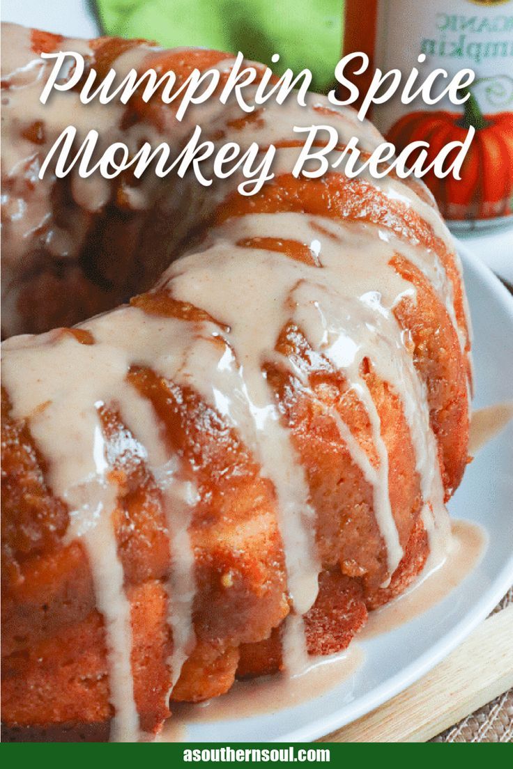 pumpkin spice monkey bread on a plate with icing drizzled over it