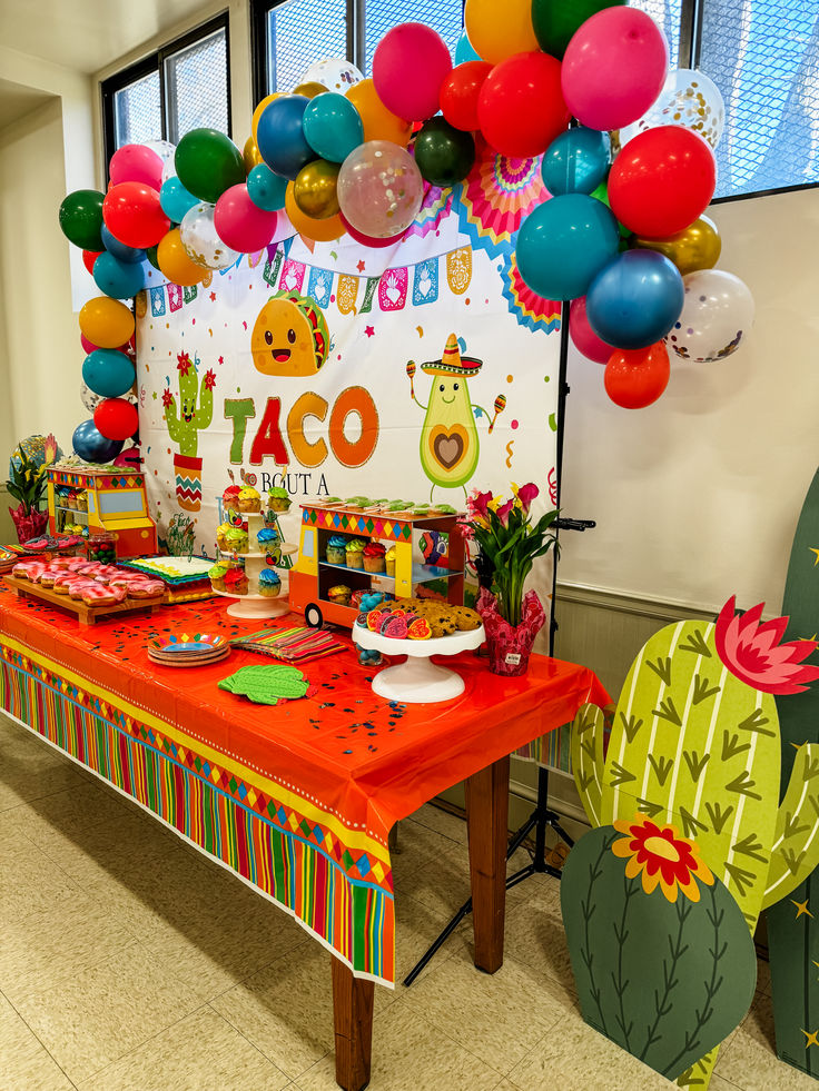 Fiesta themed baby shower with green, yellow, orange, pink, and blue decorations. Let’s Taco Bout A Baby, Mexican Food Baby Shower Ideas, Taco Themed Baby Shower Ideas, Fiesta Theme Baby Shower Ideas, Taco Baby Shower Ideas, Taco Bout A Baby Shower Ideas, Mexican Themed Baby Shower Ideas, Fiesta Baby Shower Ideas, Taco About A Baby