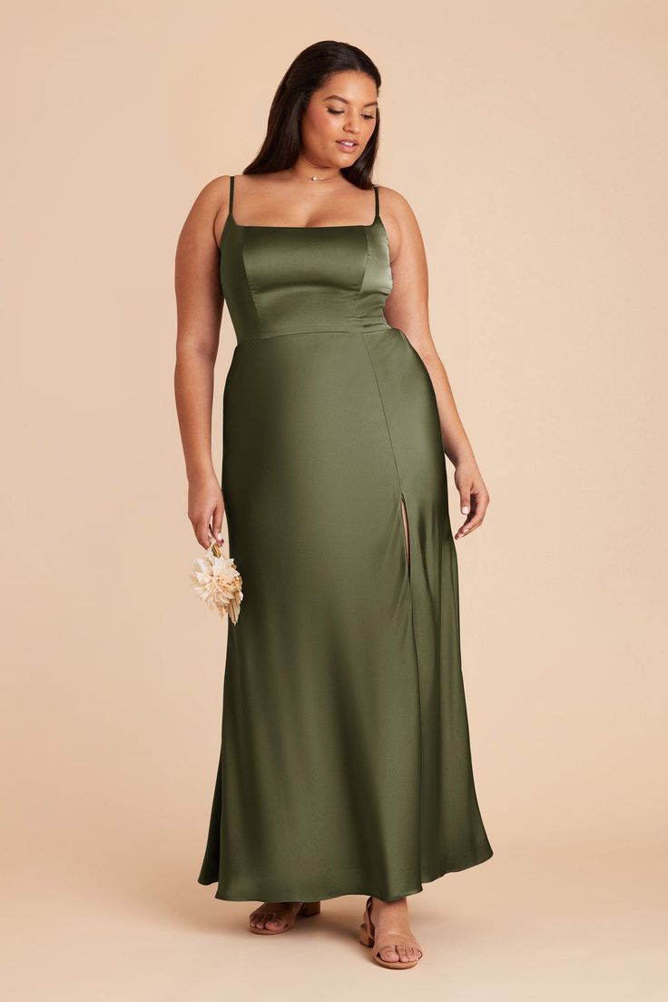 a woman in a long green dress