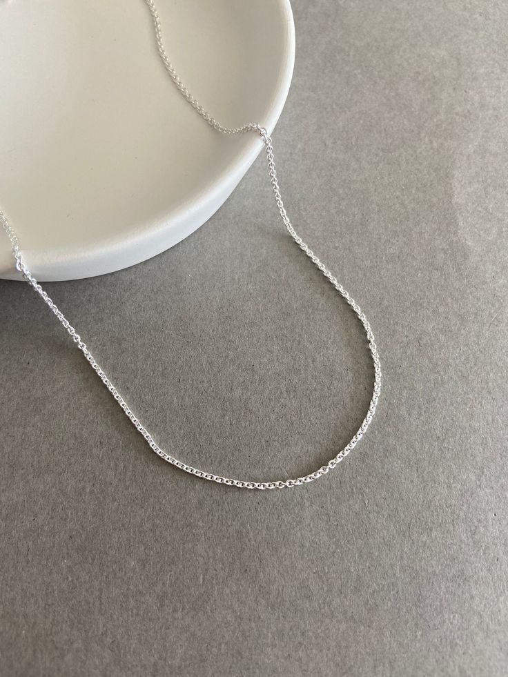 "Sterling Silver \"Rolo Chain\" Necklace Chain ★ Color : Silver ★ Material : Sterling Silver ★ Type : Rolo Chain ★ Chain Thickness : 1mm(040) / 2mm(060) ★ Chain Length : 16 inches / 18 inches / 20 inches ★ Comes in a jewelry box." Dainty Rolo Chain Link Necklace, Dainty Round Silver Chain Necklace, Simple Silver Chain Necklace Gift, Simple Silver Chain Necklace As Gift, Delicate Silver Cable Chain Necklace, Delicate Silver Link Chain Necklace, Minimalist Round Cable Chain Necklace, Minimalist Silver Necklace With Rolo Chain, Minimalist Silver Rolo Chain Necklace