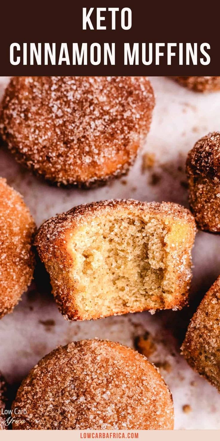 cinnamon muffins with powdered sugar on top and text overlay that reads keto cinnamon muffins