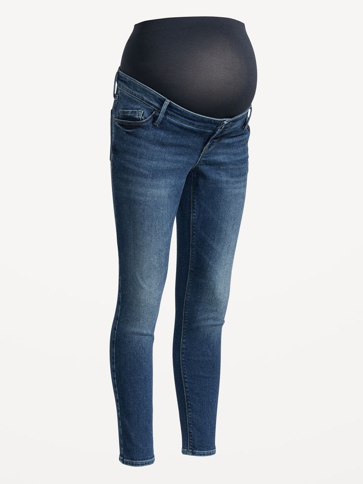 a pregnant woman's belly is shown in the shape of a jeans, with her hands on her hips