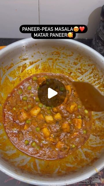 a bowl full of food with a spoon in it and the words paneer - pes masala mata mattar paneer