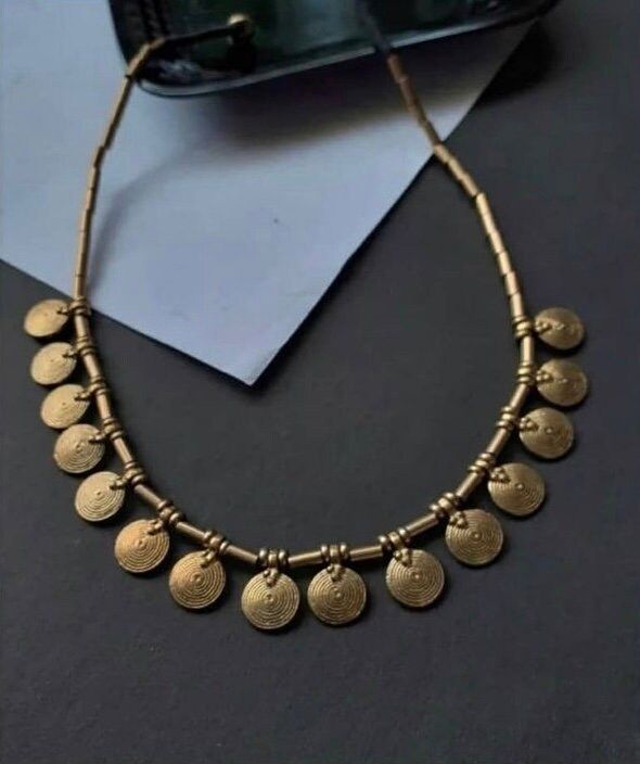 Elevate your style with our handcrafted brass choker. This luxurious statement piece features intricately designed medallions and a wax tie for a touch of uniqueness. Made from high-quality brass, it exudes elegance and durability. Whether you dress it up or down, this choker is a versatile accessory that will make a bold fashion statement. Dress up or down for a touch of luxury. Brass Choker, Floral Choker, Statement Dress, Choker Necklaces, Bold Fashion, Statement Pieces, Fashion Statement, Choker, Choker Necklace