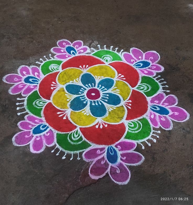 a colorful flower design painted on the ground