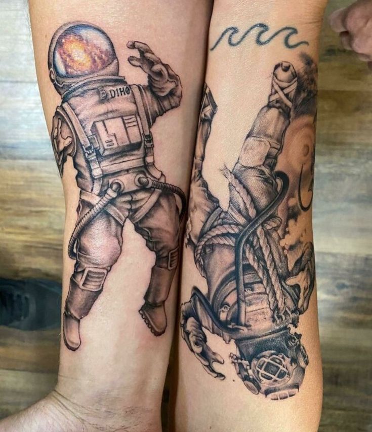 two people with tattoos on their legs, one is wearing an astronaut suit and the other has