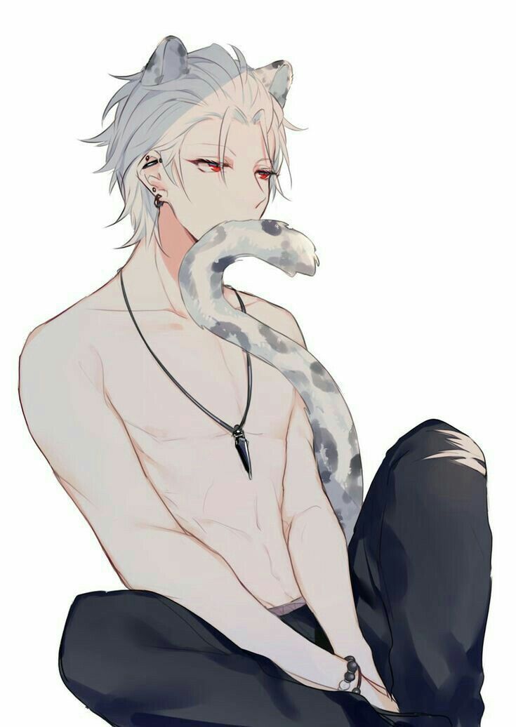 a man sitting on the ground with a snake around his neck