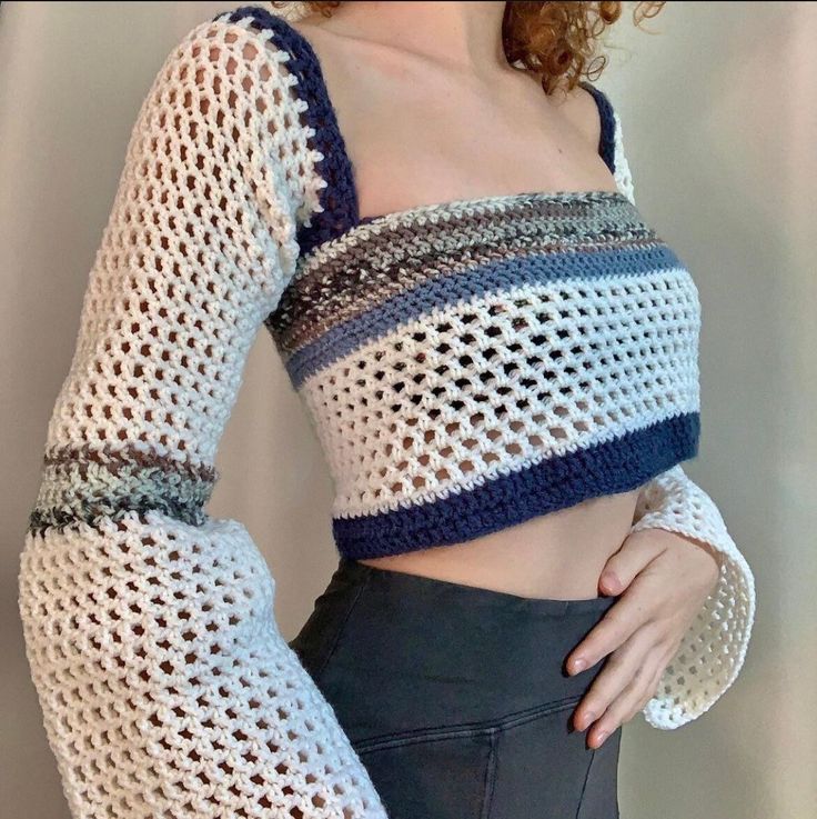 a woman wearing a crocheted crop top