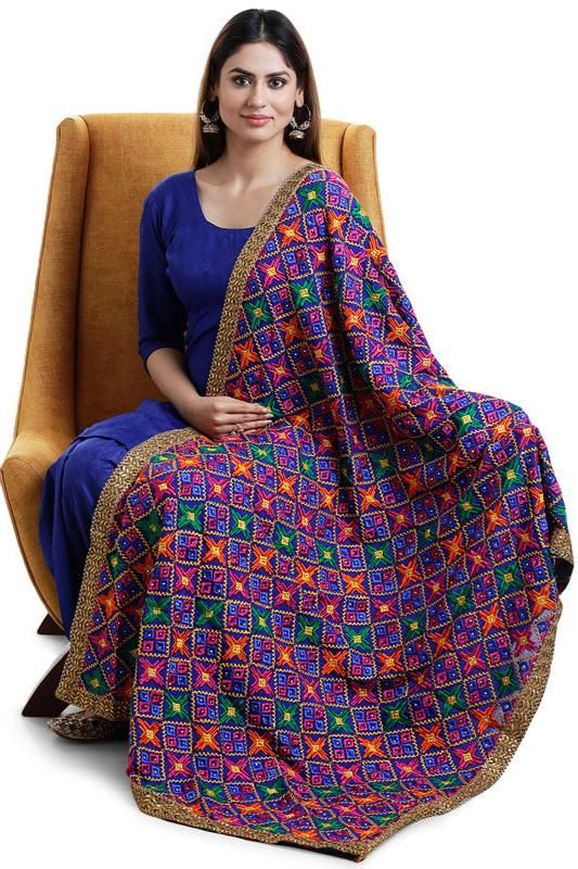 Enhance your traditional look with our Designer Phulkari Dupatta. This beautiful dupatta chunni is crafted in Chinon silk fabric with all-over heavy Phulkari embroidery and makes the perfect accessory for special occasions such as weddings, receptions and sangeet.    Chinon Silk  All over multicolor phulkari embroidery, sequins, gold border lace  Size: 2.25 meter  Dry clean  Dispatched in 1-3 business days Festive Cotton Dupatta With Resham Embroidery, Cotton Dupatta With Resham Embroidery For Festivals, Cotton Dupatta With Resham Embroidery For Navratri, Festive Cotton Dupatta With Traditional Drape, Navratri Cotton Dupatta With Resham Embroidery, Cotton Dupatta With Zari Work For Navratri, Festive Cotton Dupatta In Traditional Drape, Semi-stitched Cotton Dupatta For Festive Occasions, Bollywood Style Cotton Dupatta In Traditional Drape