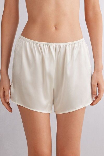 Shorts in light stretch silk satin with small side slits. Ideal to wear as a refined pair of shorts for night or as elegant loungewear. Satin Shorts For Loungewear, Satin Short Bottoms For Loungewear, Satin Lounge Shorts, White Satin Bottoms For Summer, Satin Bottoms For Loungewear, Casual Short Bottoms For Loungewear, Satin Loungewear Bottoms Short Length, Satin Loungewear Shorts, Elegant Satin Pajama Shorts For Loungewear