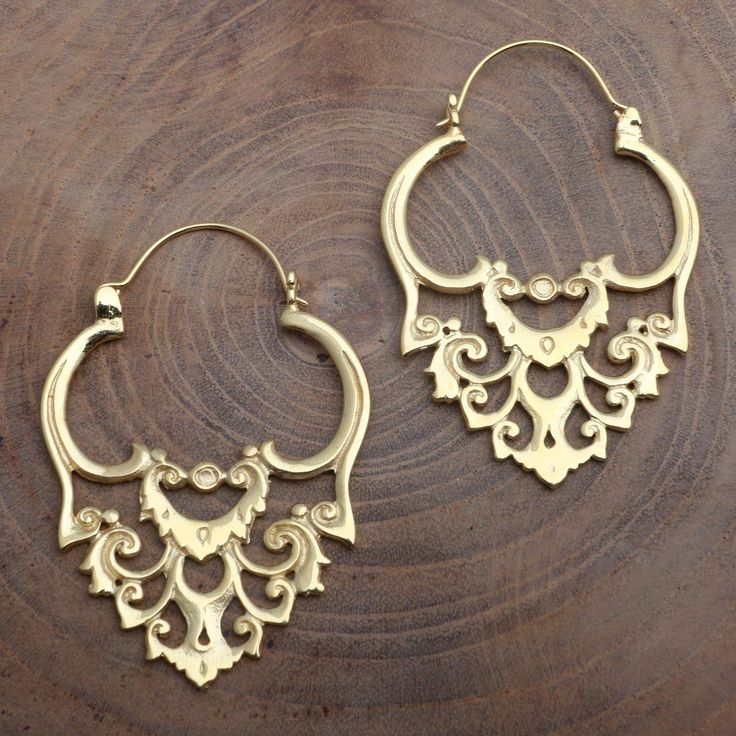 Baroque design and the warmth of polished gold capture both the eyes and the imagination in these glamorous hoop earrings. Made Nuada in Bali creates the design using 18k yellow gold over brass. Luxury Gold Sets With Intricate Design, Luxury Jewelry With Historical Baroque Design, Intricate Brass Hoop Earrings, Elegant Gold Plug Earrings In Brass, Gold Baroque Pierced Earrings, Festive Brass Hoop Earrings With Ear Wire, Festive Brass Pierced Plug Earrings, Traditional Gold Baroque Earrings, Elegant Handmade Gold Hoop Earrings