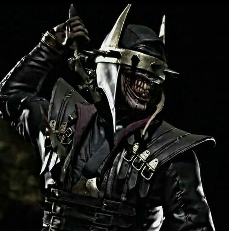 a man dressed in black and wearing a helmet with horns on his head, holding two knives