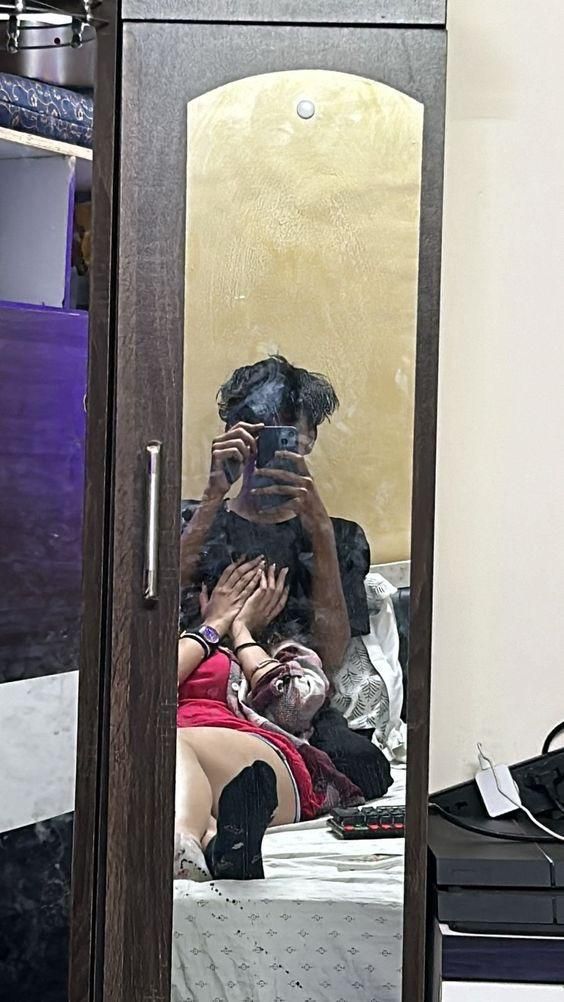 a person taking a selfie in a mirror