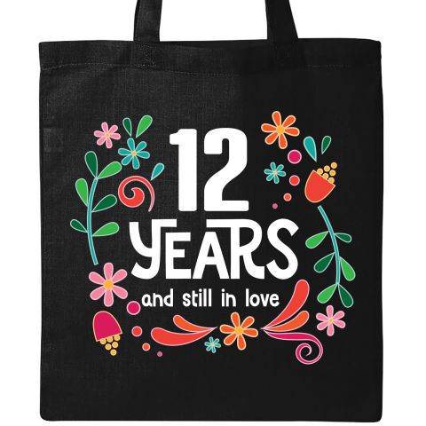 a black tote bag with the words 10 years and still in love