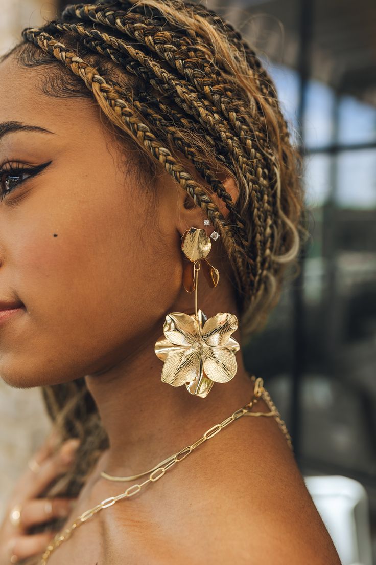 Close up of model wearing the Gianna Gold Flower Dangle Earrings. These are gold 3d flower dangle earrings. Rose Gold Metal Drop Earrings, Rose Gold Metal Drop Flower Earrings, Gold Metal Earrings With Flower Shape, Gold Metal Earrings With Flower Charm, Gold Metal Earrings In Flower Shape, Gold Metal Flower Shaped Earrings, Gold-plated Flower Earrings, Gold Plated Flower Charm Earrings, Gold Flower-shaped Earrings With Flower Charm