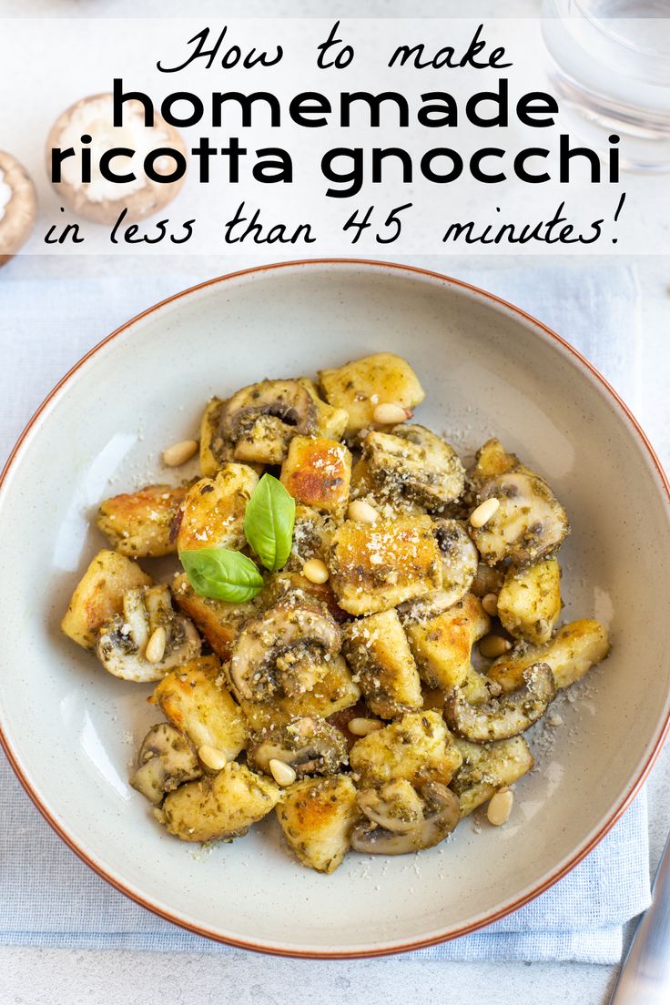 a white bowl filled with pasta and mushrooms