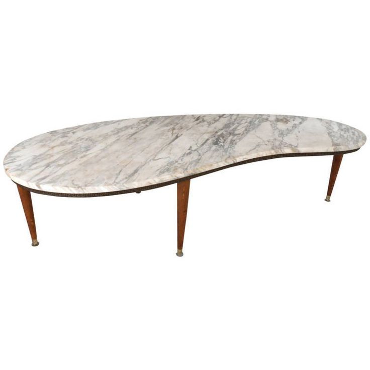 an oval marble top coffee table with wooden legs and two leaves on one end,