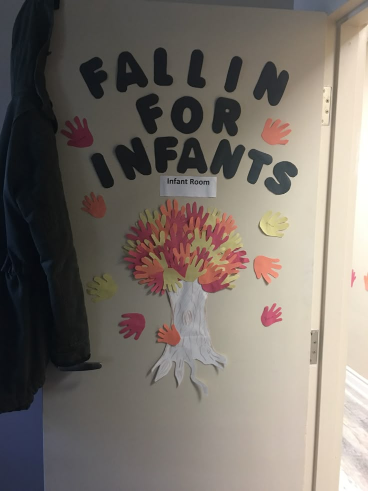 a bulletin board with handprints on it and the words failin for infants