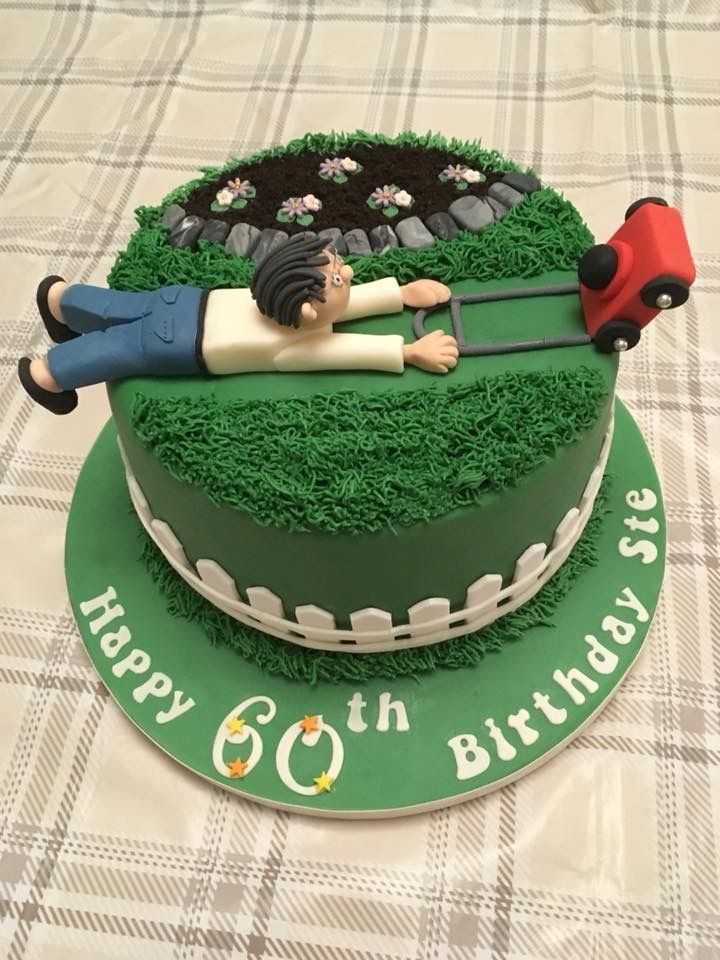 a green birthday cake with a woman laying on top of it and a red car