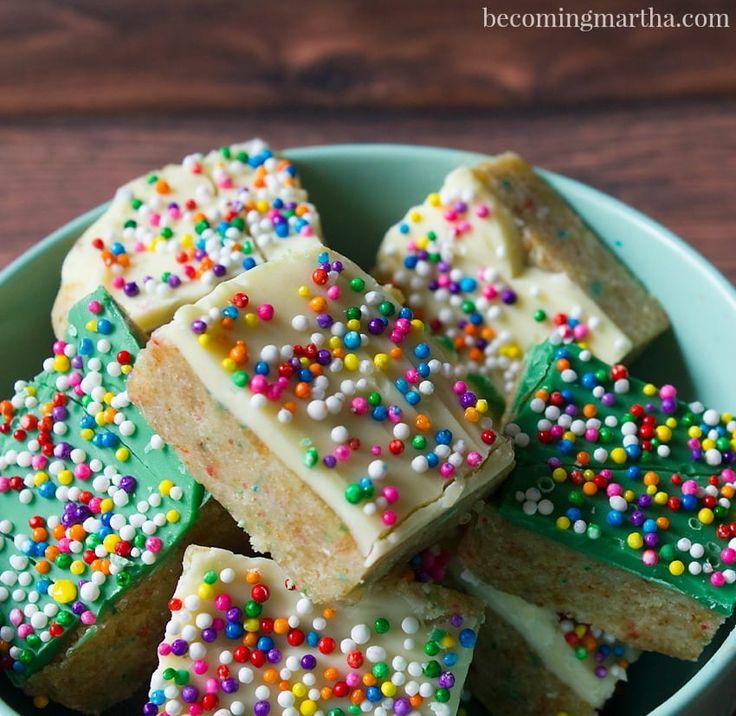 there are many pieces of cake with sprinkles on it in the bowl