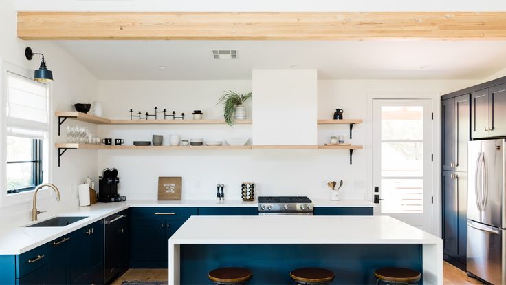 the kitchen is clean and ready for us to use as an entertaining spot or dining area