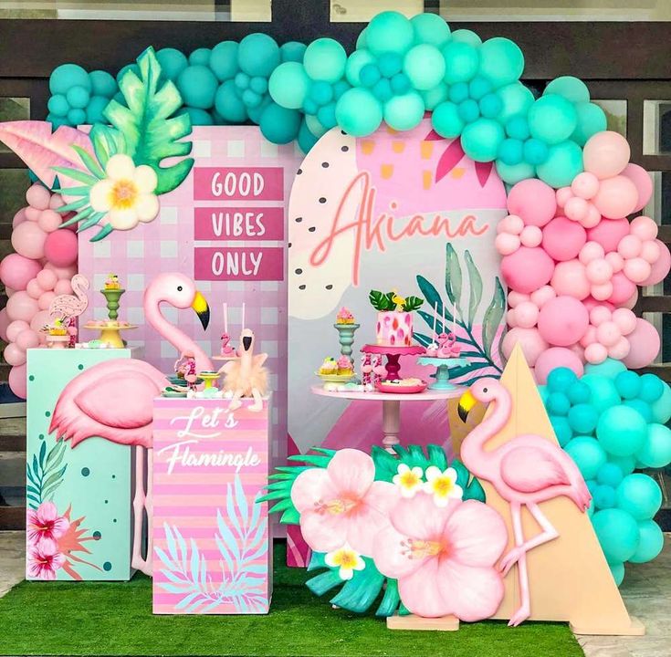 a flamingo themed birthday party with balloons and decorations