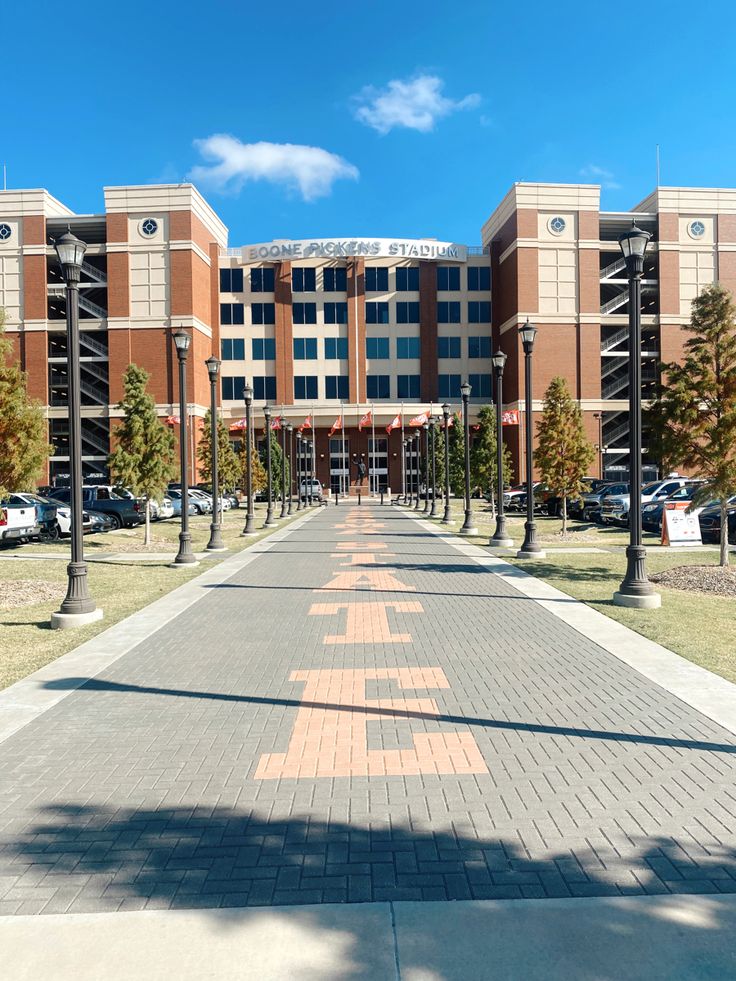 an empty street in front of a large building