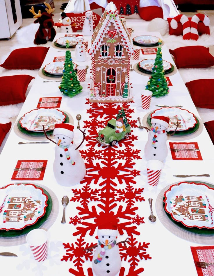 a table set for christmas with plates and napkins