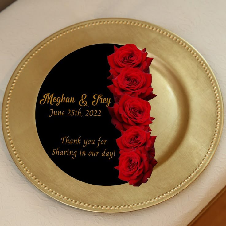 a gold plate with red roses on it for a wedding or special occasion to the couple