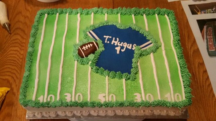 a football themed sheet cake on a table