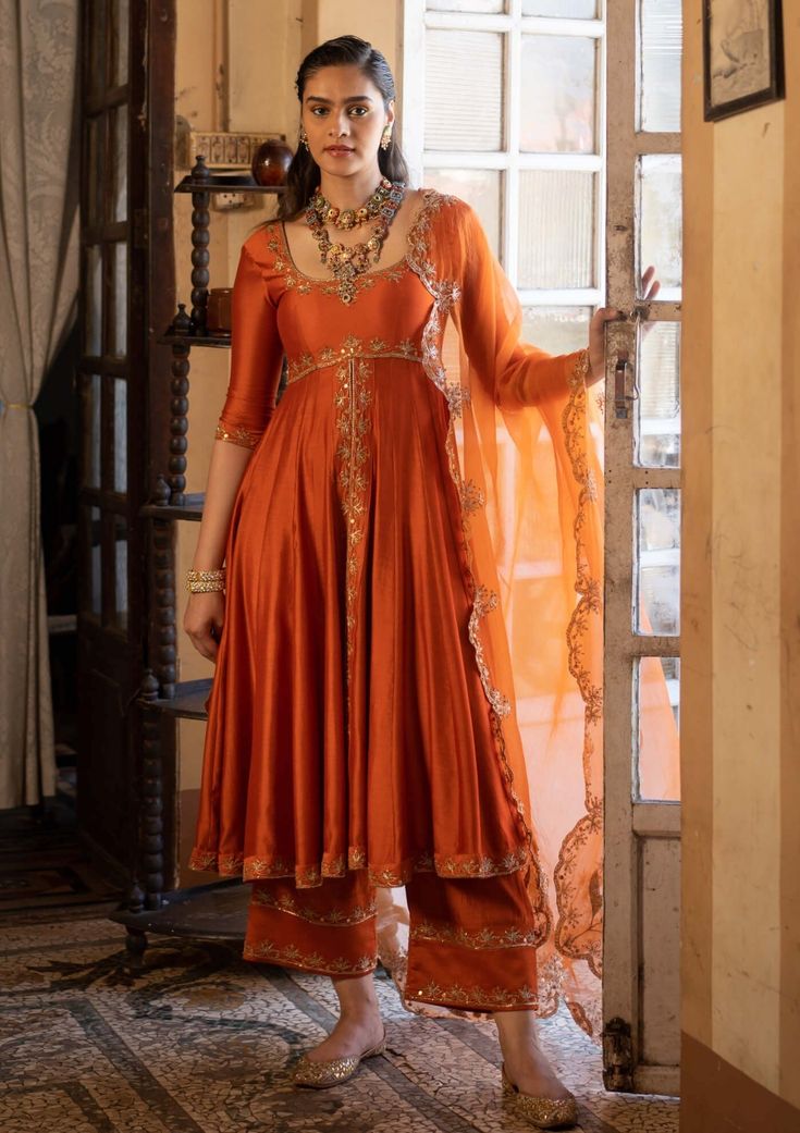 Paulmi & Harsh-Burnt Orange Anarkali Set-INDIASPOPUP.COM Elegant Anarkali Suits, Tissue Anarkali Dress, Embroidery On Orange Fabric, Tissue Fabric Dress Design, Silk Dresses Indian, Rust Orange Lehenga, Elia Martell, Orange Anarkali, Gharara Designs