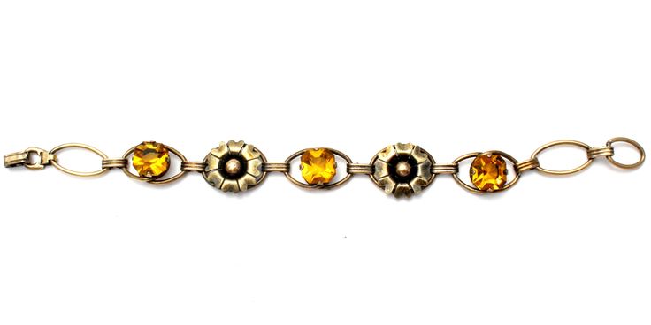 Antique Bracelet - This is a 12K gold filled over sterling silver citrine rhinestones flower bracelet. It is signed PR. ST. CO for Providence Stock Co., hallmarked 1/20 12K on Sterling, 6.25" long, slightly over .5" wide, weighs 8.6 grams. Formal Gold Jeweled Bracelets, Formal Yellow Gold Jeweled Bracelets, Gold Jeweled Bracelets For Formal Occasions, Elegant Gold Citrine Crystal Bracelet, Yellow Gold Jeweled Bracelets For Formal Occasions, Yellow Gold Jeweled Bracelet For Formal Occasions, Jeweled Yellow Gold Bracelets For Formal Occasions, Antique Gold Citrine Jewelry, Vintage Yellow Gold Bracelets With Jewels