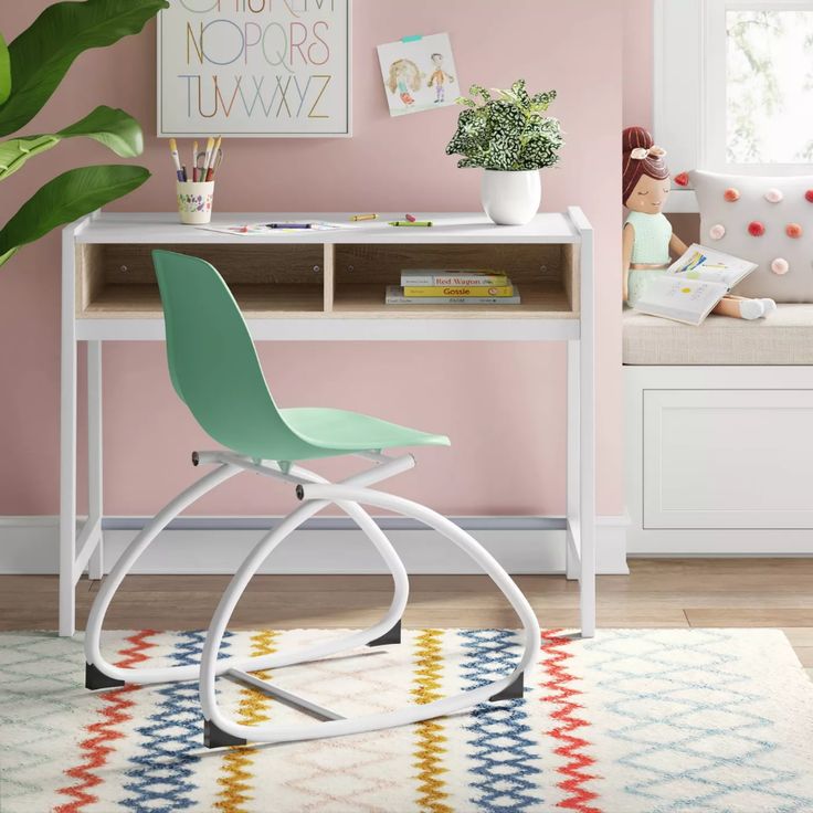 a chair sits in front of a desk with a potted plant next to it