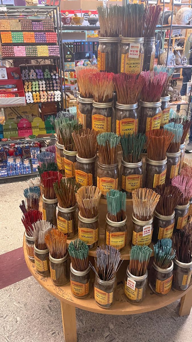 there are many different types of incenses on display in the store and one is for sale