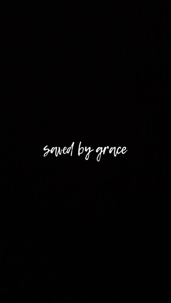 the words saved by grace written in white on a black background