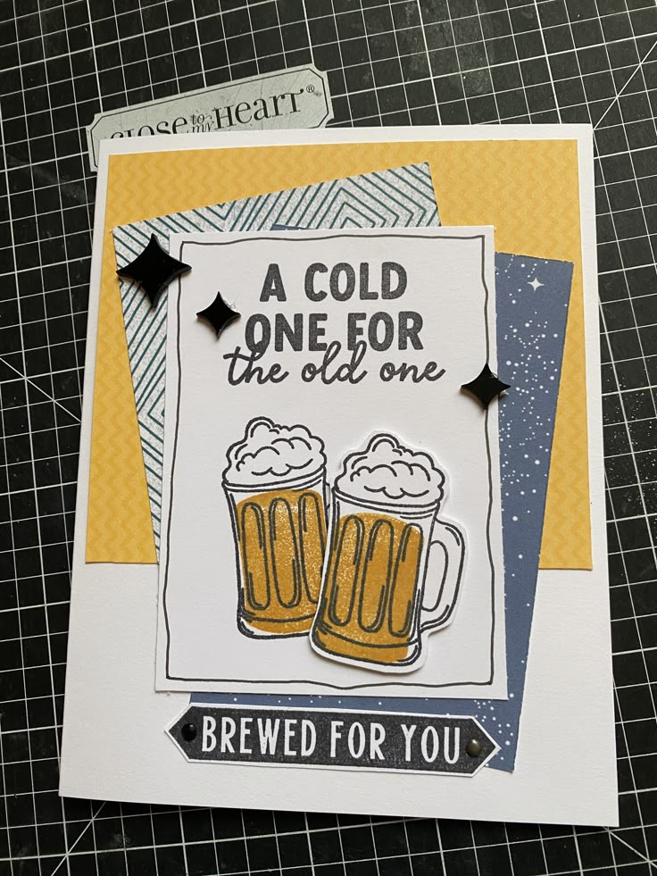 a card with two mugs of beer on it and the words, a cold one for