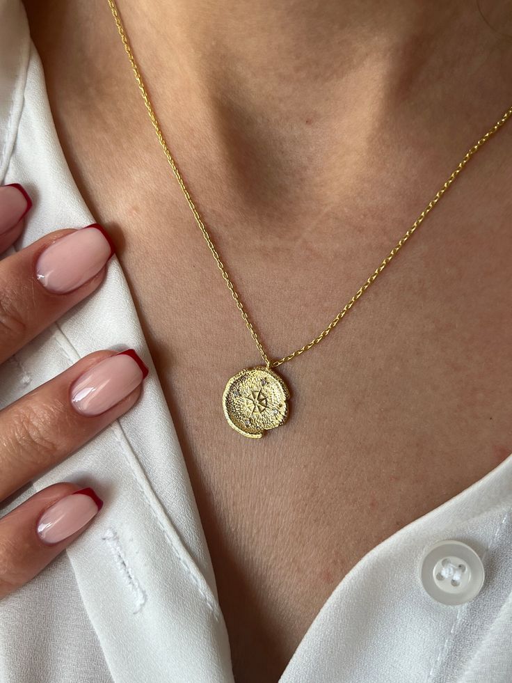 Find your direction with our Compass Necklace  Get this cute jewelry made with the high quality elements✨ You can go with 925K Sterling Silver with the options of Gold, Rose Gold or White Gold finish Beautiful jewelry for everyone 💙 Details * 925K Sterling Silver → 14K Gold, Rose Gold or White Gold plated * Chain length is approximately 18 inches (16+2 in extender) / 45 cm (40+5 cm extender) * Time is important! You will receive your package as soon as possible 🚚 * We care about the quality of Engraved Flower Pendant Jewelry For Everyday, Everyday Engraved Flower Pendant Jewelry, Yellow Gold Medallion Pendant Necklace For Everyday, Everyday Yellow Gold Medallion Pendant Necklace, Dainty Gold Plated Tarnish Resistant Medallion Necklace, Dainty Gold Plated Tarnish-resistant Medallion Necklace, 14k Gold Medallion Necklace Amulet Style As A Gift, 14k Gold Tarnish Resistant Medallion Pendant Necklace, 14k Gold Amulet Coin Necklace Tarnish Resistant