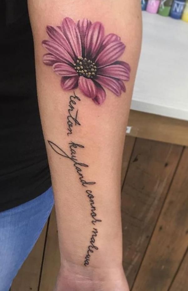 a woman's arm with a flower on it