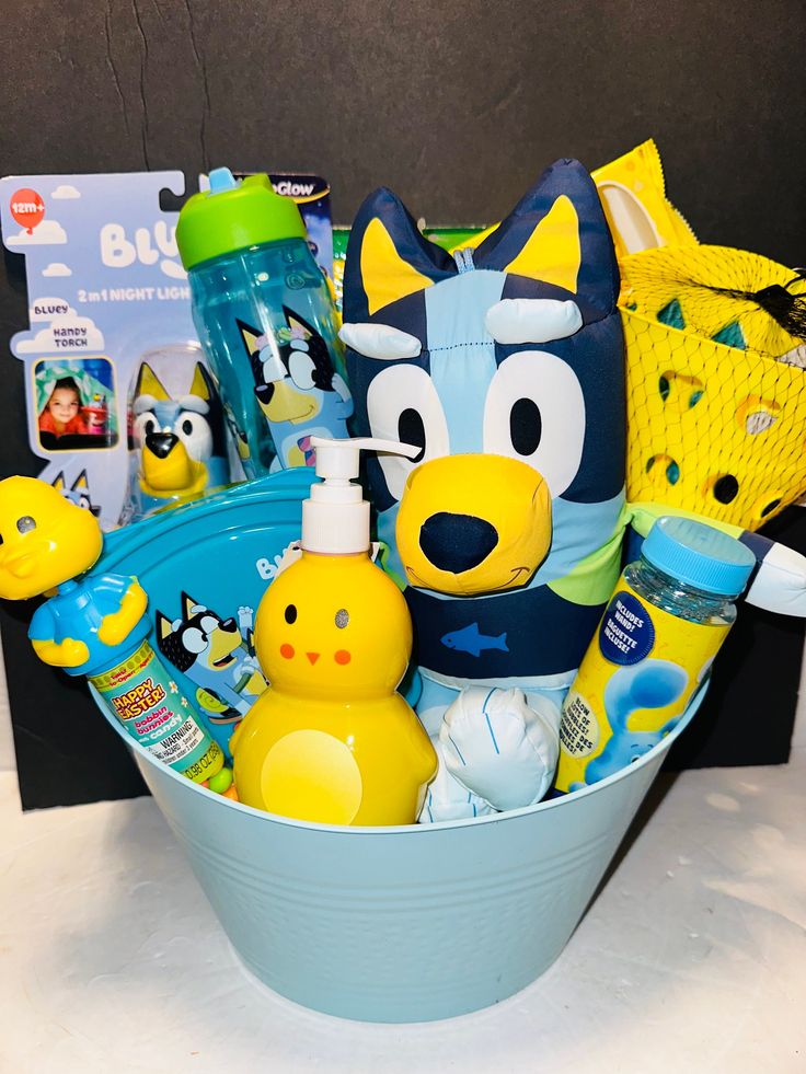 a blue bucket filled with lots of toys