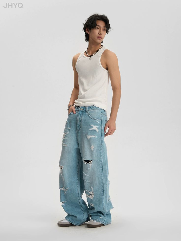 Light Wash Baggy Jeans with Distressed Holes Style and Fit Our Light Wash Baggy Jeans with Distressed Holes offer a trendy and relaxed look, perfect for a casual day out. Designed with a comfortable fit, these jeans feature strategically placed distressed holes, giving them a cool and edgy vibe. Model Details Male Model: Height: 183 cm, Weight: 65 kg, wearing Size XL Female Model: Height: 173 cm, Weight: 47 kg, wearing Size M Size Suggestion To help you find the perfect fit, we recommend the following size guide: S-M: 160-170 cm, 45-55 kg M-L: 170-175 cm, 55-65 kg L-XL: 175-180 cm, 65-75 kg XL-XXL: 180-185 cm, 75-90 kg Please refer to this guide as a recommendation to find your ideal size. Summer Distressed Relaxed Fit Pants, Casual Pants With Frayed Hem, Baggy Ripped Pants For Summer, Casual Ripped Summer Pants, Casual Ripped Pants For Summer, Casual Distressed Blue Pants, Casual Blue Distressed Pants, Casual Wide Leg Ripped Pants, Urban Distressed Pants For Summer