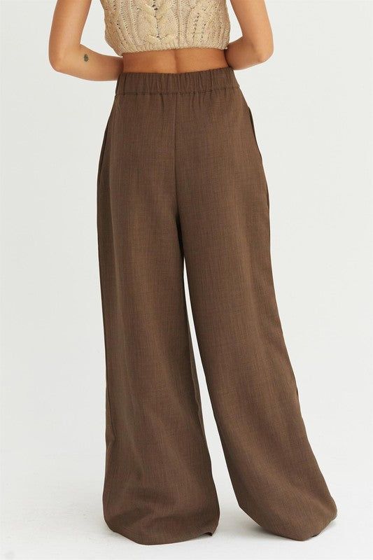 Brown wide leg pleated trousers, button front with a back elastic waistband, side pockets Sizes S, M and L Fabric: 97% polyester, 3% spandex Wide Leg Pleated Trousers, Fitted Jacket, Pleated Trousers, Brown Pants, Office Attire, Professional Look, Workout Jacket, Office Wear, Polished Look